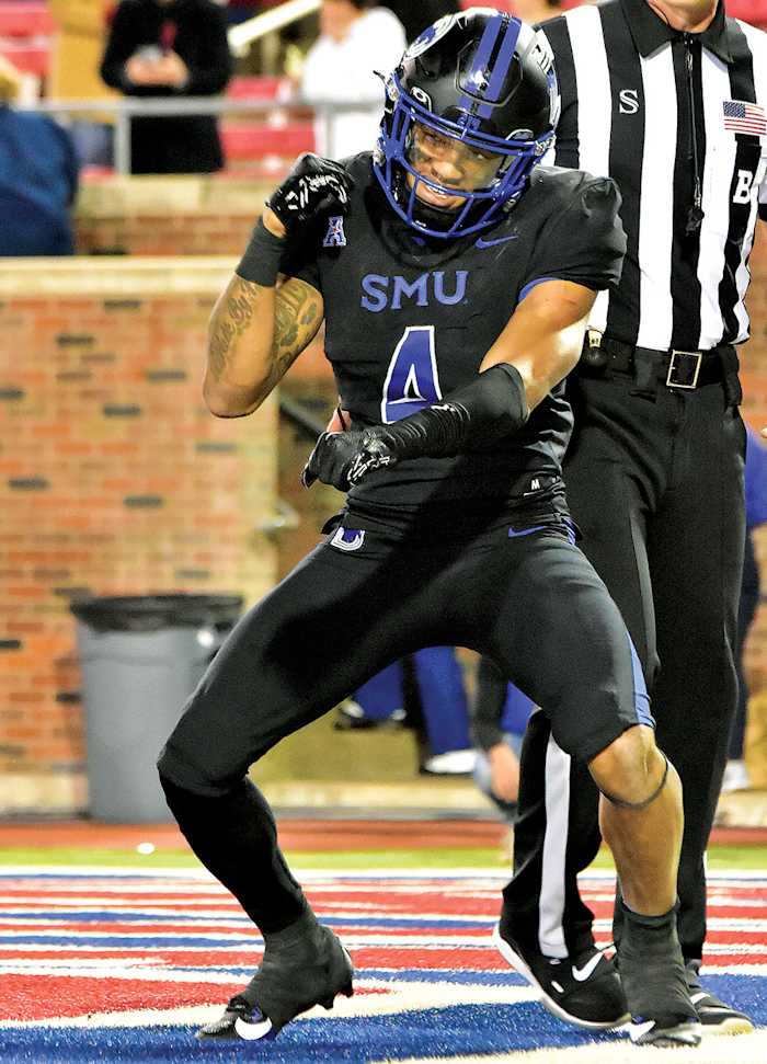 SMU running back Jaylan Knighton celebrates a touchdown in the third quarter of the Mustangs' 45-21 win over North Texas at Ford Stadium in Dallas.